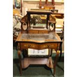 AN EDWARDIAN LADIES WRITING DESK, with raised back, having bevelled mirrored panels, two glass ink