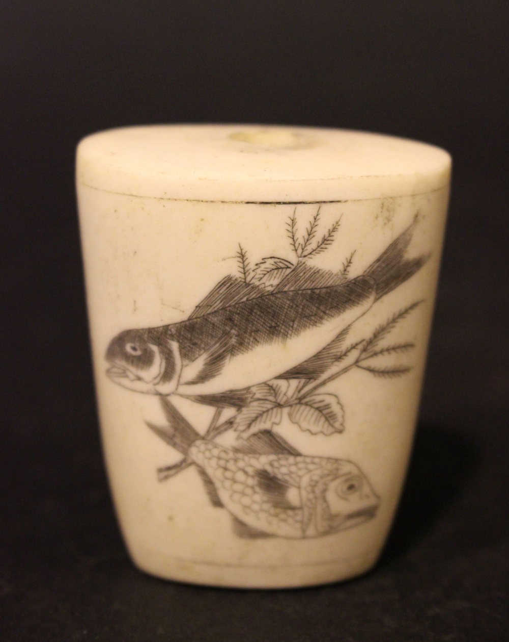 A BONE/IVORY SNUFF BOTTLE, a tapered shape, with ebonised etching of fish imagery on two sides, no