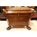 A FINE IRISH GEORGIAN MAHOGANY WINE COOLER / CELLARET raised on lion paw feet, original gilded