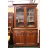 AN EARLY 20TH CENTURY 2 DOOR GLAZED BOOKCASE, with 2 door glazed case, over 2 drawers over 2 door