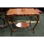 A THOMAS WALLIS CENTRE / SIDE TABLE, with scalloped rim, raised on bentwood "antler" legs, united by