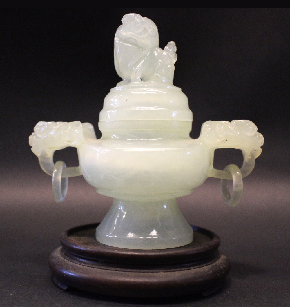 A CARVED JADE TWO HANDLED CENSER WITH LID, the lid having an open mouthed guardian lion, the handles