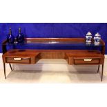 AN ITALIAN ROSEWOOD MID CENTURY MODERN DRESSING TABLE, with curved glazed gallery shelf, over 2