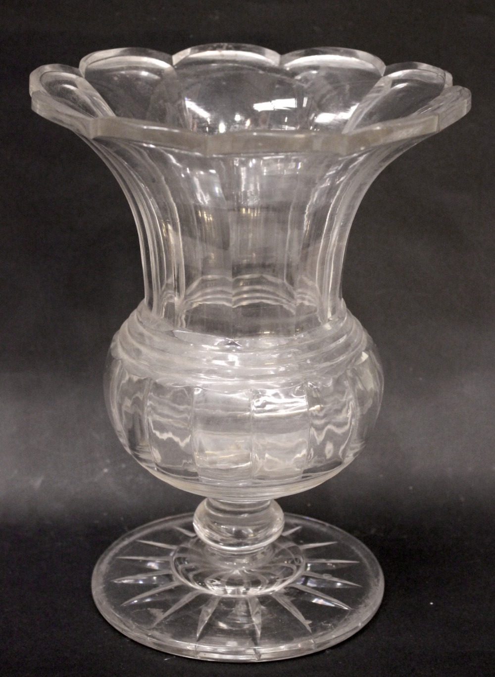 AN IRISH 19TH CENTURY GLASS TULIP BOWL, with scalloped rim and broad fluted body, on a circular star