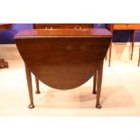 A VERY FINE GEORGIAN MAHOGANY DROP LEAF TABLE, with deep D-end leaves, opens to a large oval