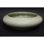 A LARGE CHINESE CELADON ‘BULB’ BOWL, 18th Century, with carved interior design of a dragon