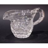 A FINE LATE 19TH CENTURY IRISH CUT GLASS JUG, with step cut spout and ribbed handle, with strawberry