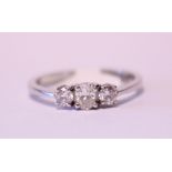 AN 18CT WHITE GOLD THREE STONE DIAMOND RING