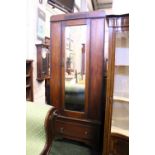 AN EARLY 20TH CENTURY OAK 1 DOOR WARDROBE, with bevelled mirror panel, carved details on a single