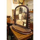 A MAHOGANY "SWING" DRESSING MIRROR, table top, with turned upright supports, and demi lune