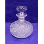 A SMALL CROSSHATCH MOULDED GLASS DECANTER, with broad fluted neck, with stopper