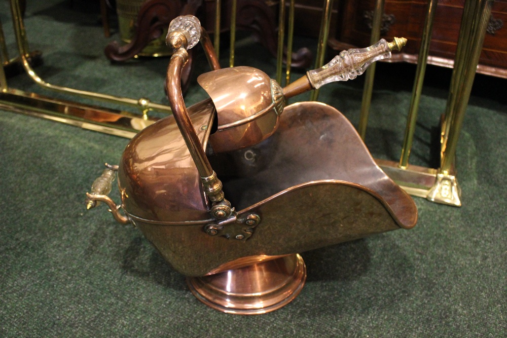 A COPPER & BRASS 'HELMET' COAL BUCKET, with a glazed handled and with a shovel