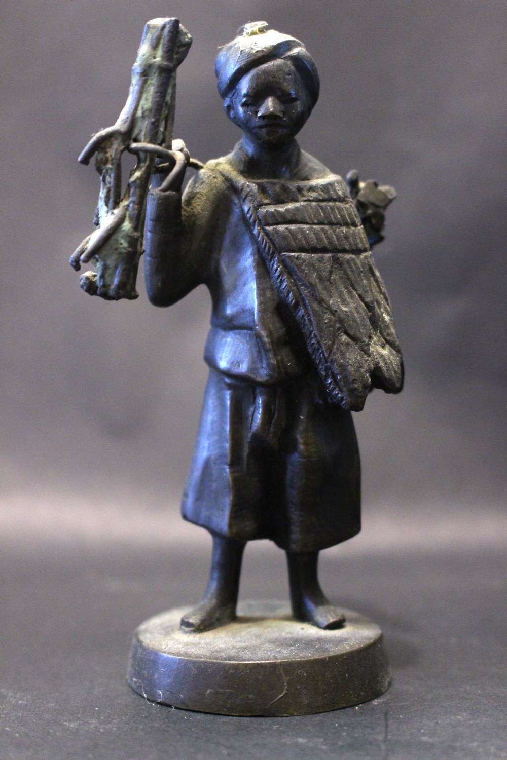 A 19TH CENTURY MINATURE BRONZE SCULPTURE, Possibly Japanese, of a boy carrying bamboo, 13cm high