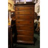 A 7 DRAWER TALL BOY / CHEST, with dentil cornice, over carved frieze, above 7 brass handled drawers,