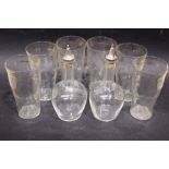 A SET OF 6 GLASSES & A PAIR OF GLASS VINEGARETTE BOTTLES, having silver plated cork stoppers, each