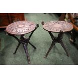A PAIR OF HANDCARVED SIDE / LAMP TABLES, the tops detach and the base folds up, tops decorated