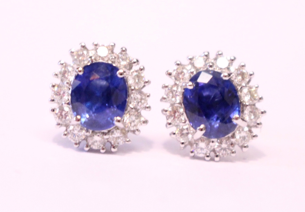 A PAIR OF 18CT WHITE GOLD, SAPPHIRE & DIAMOND CLUSTER EARRINGS, 2.20ct sapphire, 1.40cts diamond