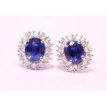 A PAIR OF 18CT WHITE GOLD, SAPPHIRE & DIAMOND CLUSTER EARRINGS, 2.20ct sapphire, 1.40cts diamond