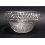 AN IRISH CUT GLASS CENTRE BOWL with diamond cut roll over rim, with angled step cut design to the