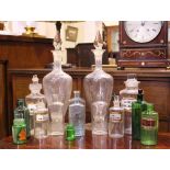 AN INTERESTING COLLECTION OF IRISH APOTHECARY / CHEMIST BOTTLES, with various shapes and colours, 15