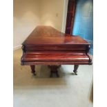 A VICTORIAN CONCERT GRAND PIANO, with carved foliage detail to side arms, and lyre shaped pedal