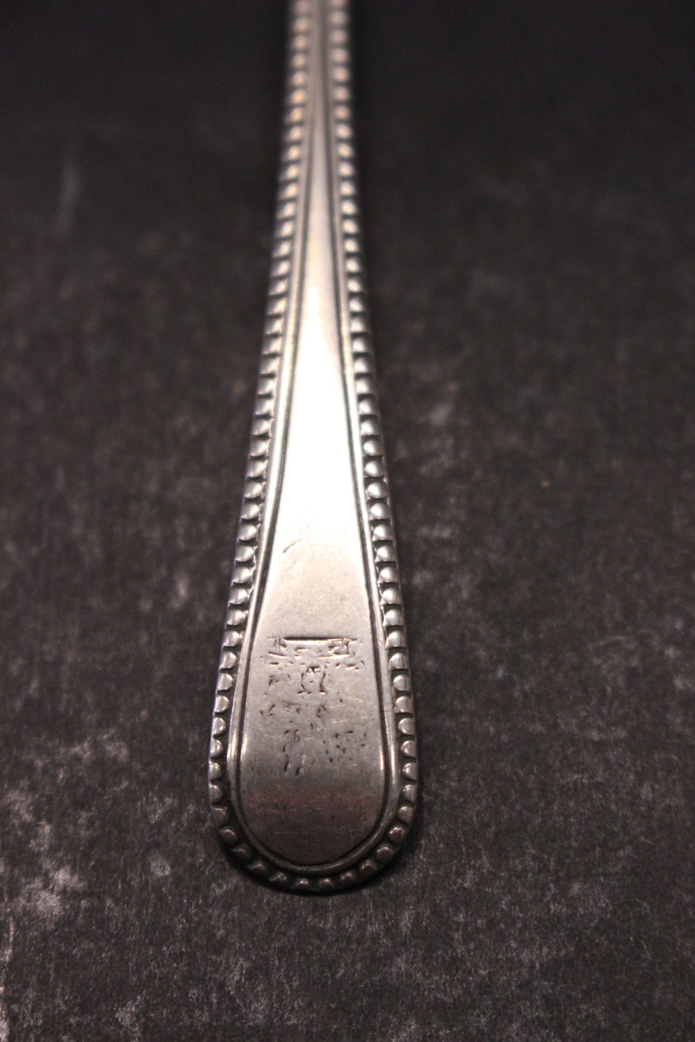 A GEORGIAN SILVER TEASPOON, possibly London, 1822, maker’s mark indistinct, with beaded detail to - Image 2 of 4