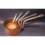 A SET OF 5 COPPER SAUCE PANS