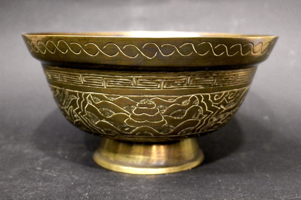 A 20TH CENTURY (EARLY/MID) CHINESE BRASS BOWL, with incised decoration, showing a dragon, bird & bee