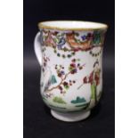 AN 18TH CENTURY CHINESE PORCELAIN MUG, of baluster form with plain loop handle, painted in famille