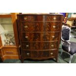A VERY FINE BOW FRONTED 'FLAME' MAHOGANY CHEST, 5 graduating drawers, each with brass pull handle,