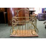 A VICTORIAN BRASS & MAHOGANY CANTERBURY STAND, with lyre shaped brass supports, a raised curved