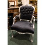 A CONTEMPORARY LOUIS XV STYLE CHAIR, with black patterned fabric upholstery and silver coloured