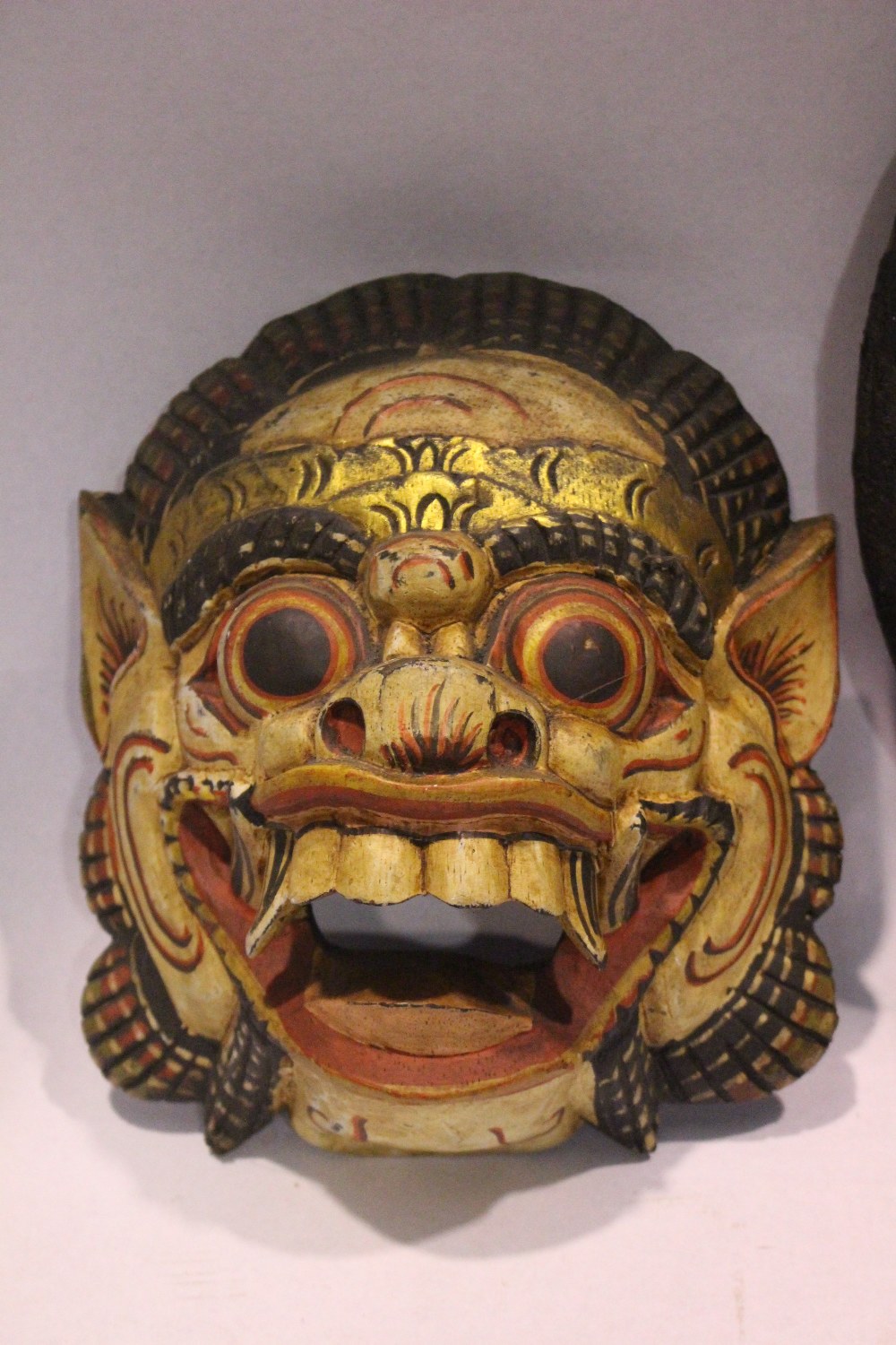 TWO CARVED 'TRIBAL' MASKS, (i) An open mouthed lion, colourful mask, 8" x 7" x 3.5" approx (ii) An - Image 2 of 3