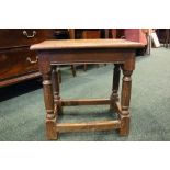 A SMALL OAK 'JOINT STOOL' with turned legs, and plain stretcher, 16.5" x 10" x 17.5" approx