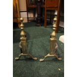 A PAIR OF BRASS & CAST IRON FIRE DOGS, with finial detail