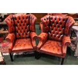 A VERY FINE PAIR OF RED LEATHER BUTTON BACKED WING BACK ARMCHAIRS, raised on square reeded frame,