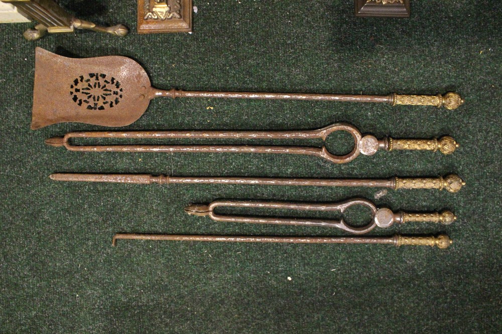 A SET OF FIRE IRONS, (5 piece) includes, shovel with pierced bowl, two tongs, two pokers, each