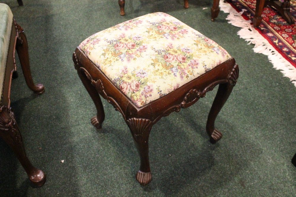 AN IRISH 19TH CENTURY CARVED FOOTSTOOL, with shell motif to the knees and apron, having a stuffed