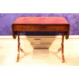 A MAHOGANY REGENCY STYLE SOFA TABLE, with drop leaves, 2 frieze drawers and 2 faux drawers, raised