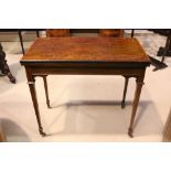 A FINE EDWARDIAN FOLD OVER CARD TABLE, mahogany, raised on tapered leg on castors, the top