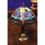 A TIFFANY STYLE TABLE LAMP, with dragon fly shade, and a shaped column with circular base, multi