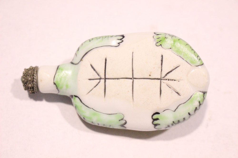 A PORCELAIN SNUFF BOTTLE, in the form of a turtle, with floral decoration to its back, a stopper - Image 4 of 4