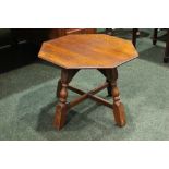 A LOW RISE OAK 'JOINT' TABLE, octagonal in shape, with turned legs united by an 'x' stretcher, 22" x