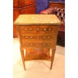 A MARBLE TOPPED CABINET, with brass gallery rail, 2 short drawers over 2 long, raised on tapered