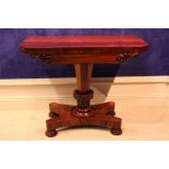 A WILLIAM IV ROSEWOOD FOLD OVER CARD TABLE, with carved frieze detail, raised on octagonal graduated