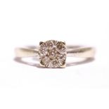 A 9CT WHITE GOLD CLUSTER DIAMOND RING, with round brilliant cut diamonds in a floral shaped setting