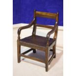 A 19TH CENTURY GEORGIAN STYLE CHILDS CHAIR, with down swept armrests supported by turned columns,