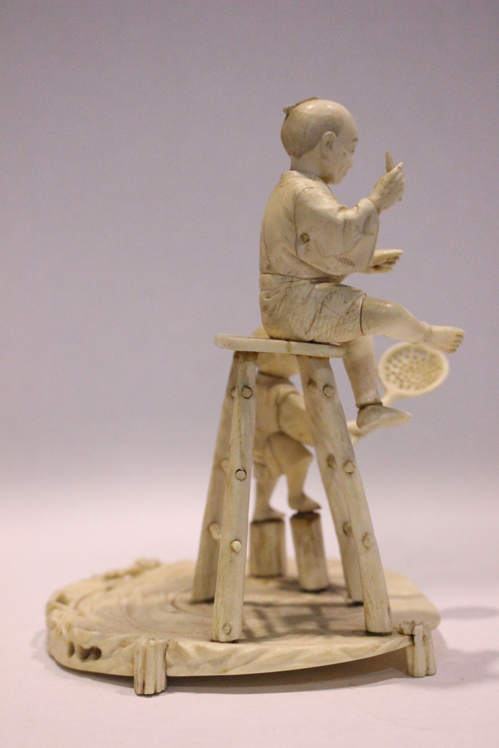 A JAPANESE CARVED FIGURAL GROUP, a man on a stool with a boy standing to his side, 6.75" tall approx - Image 5 of 7