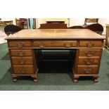 A LARGE MAHOGANY PEDESTAL DESK, with tooled leather top, gadrooned edge, over 3 frieze drawers on