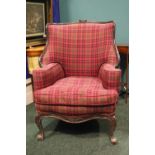 AN EARLY 20TH CENTURY MAHOGANY BERGÉRE STYLE ARMCHAIR, with carved rose detail to the crest rail,